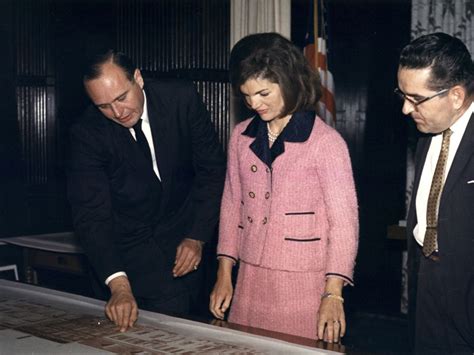 pink chanel suit splattered with his blood|Pink Chanel suit of Jacqueline Bouvier Kennedy .